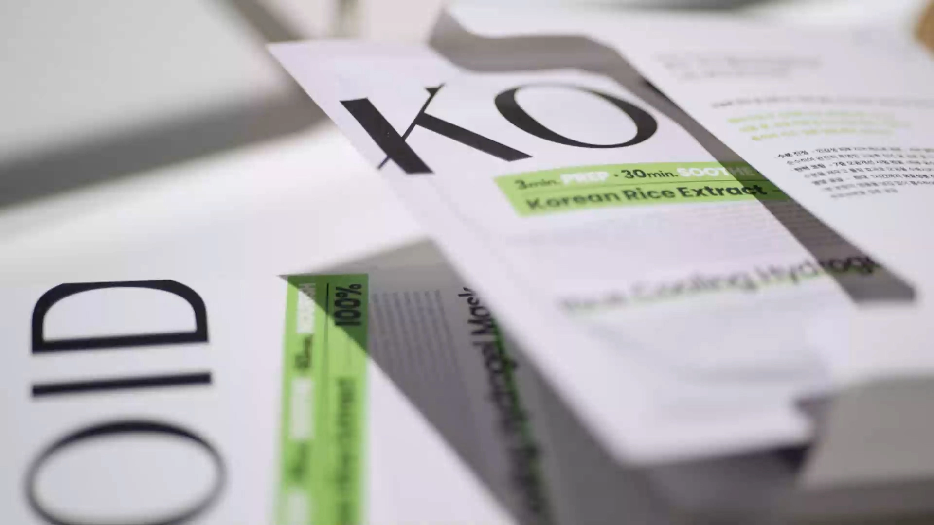 Close-up of KOID Rice Cooling Hydrogel Mask packaging with white box and green labels and individual pouches